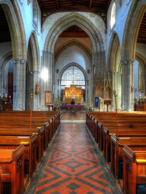 church interior showing tiled floor and arches