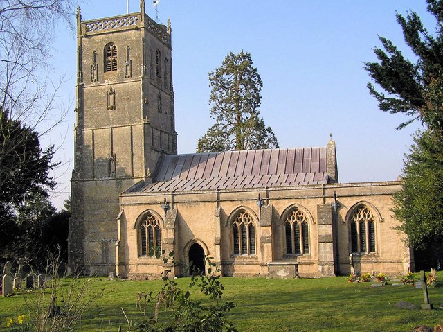 Church exterior with bell tower on left side and lead roof