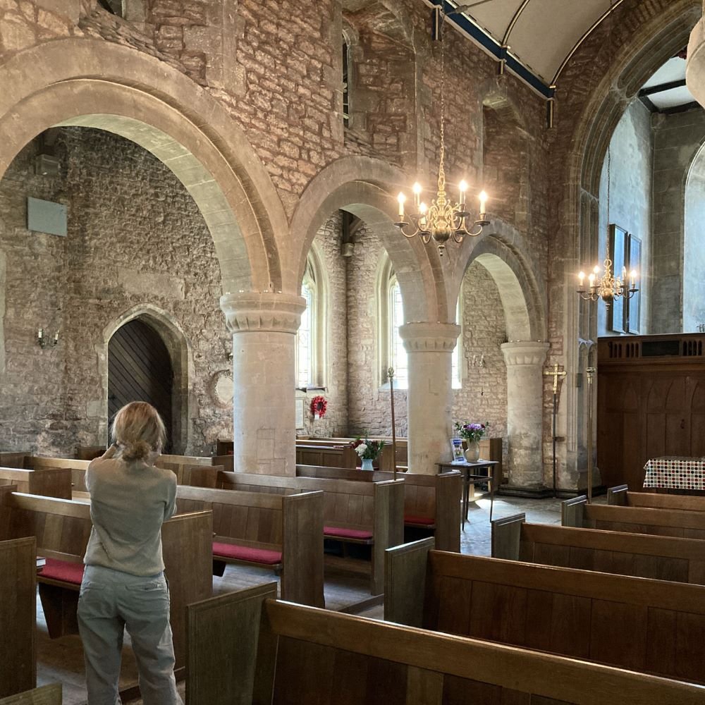 Image of artist Ilene Sterns taking photographs of the interior of St Michael's Church