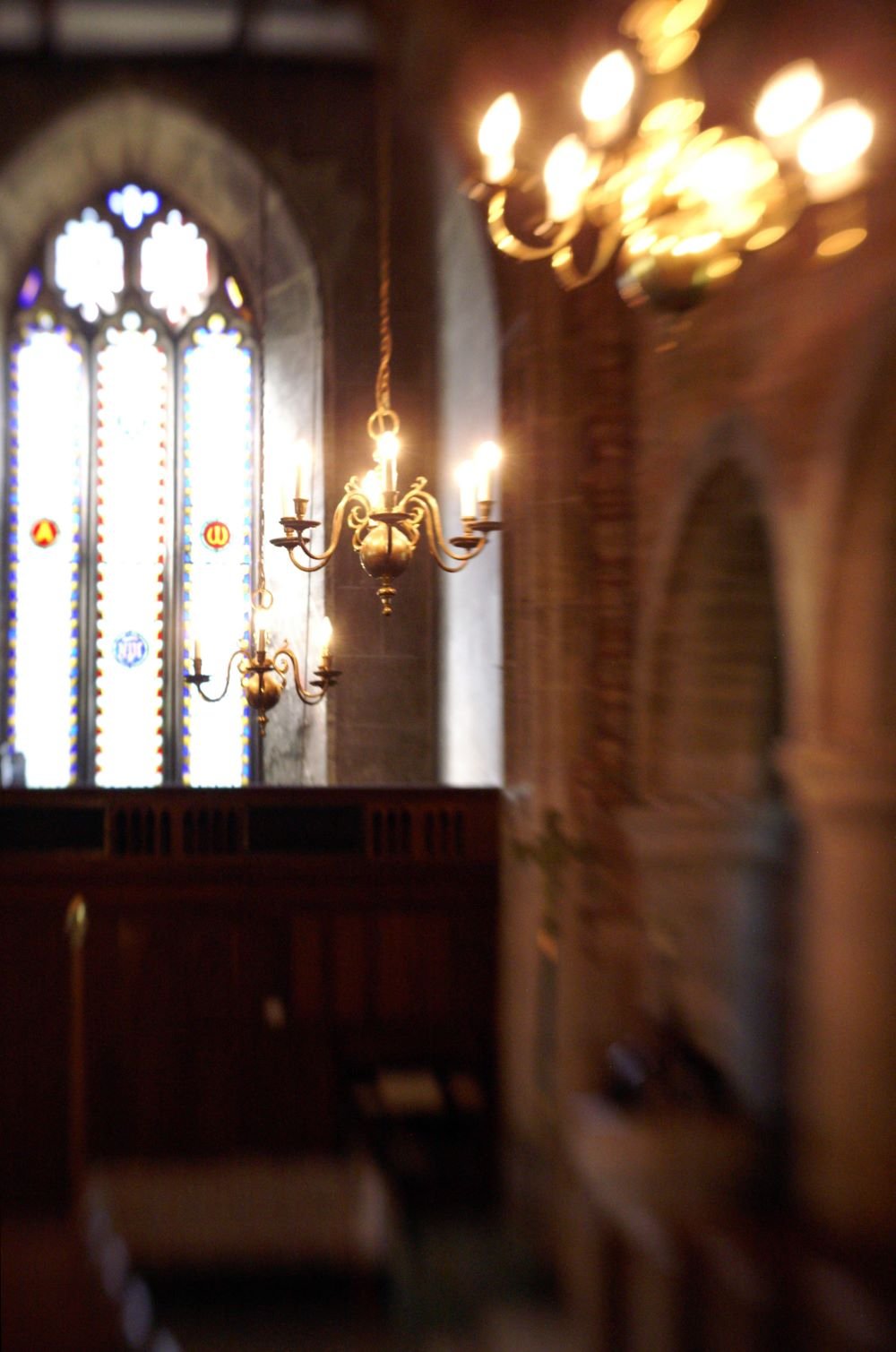 Image shows lighting within the interior of a church in soft focus