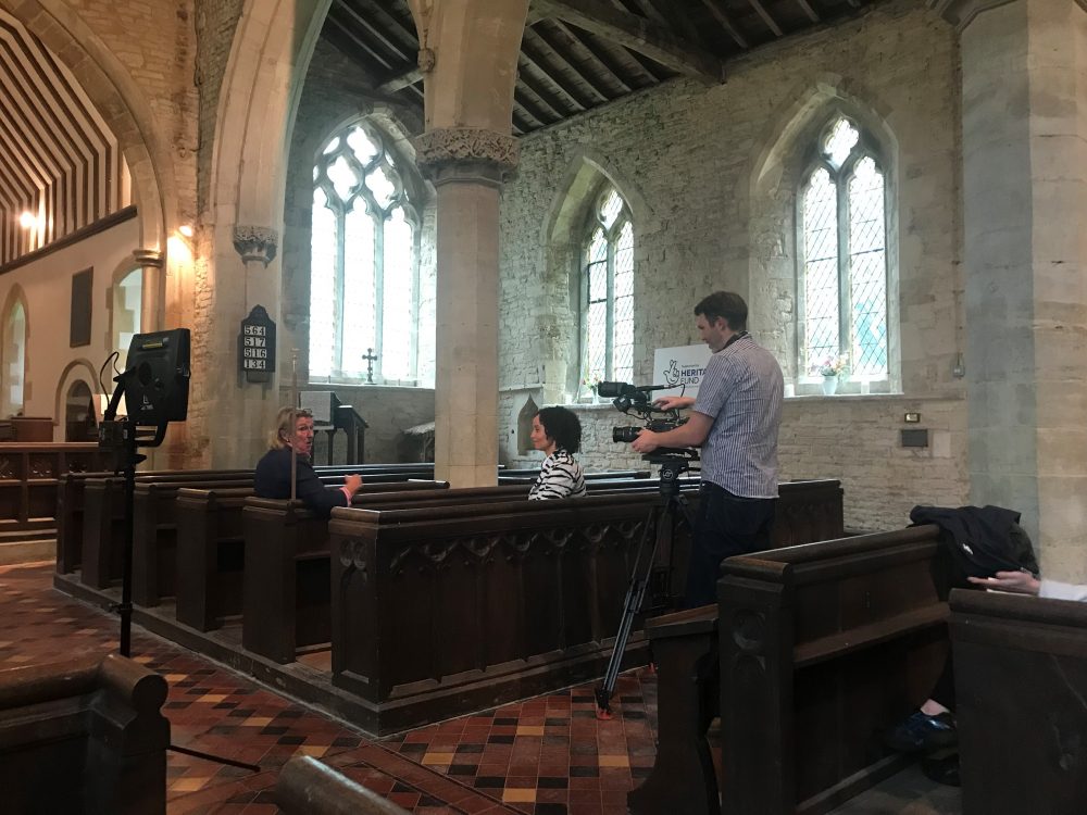 BBC Songs of Praise presenter Gemma Hunt interviewing churchwarden Penny Bonner inside St Lawrence church