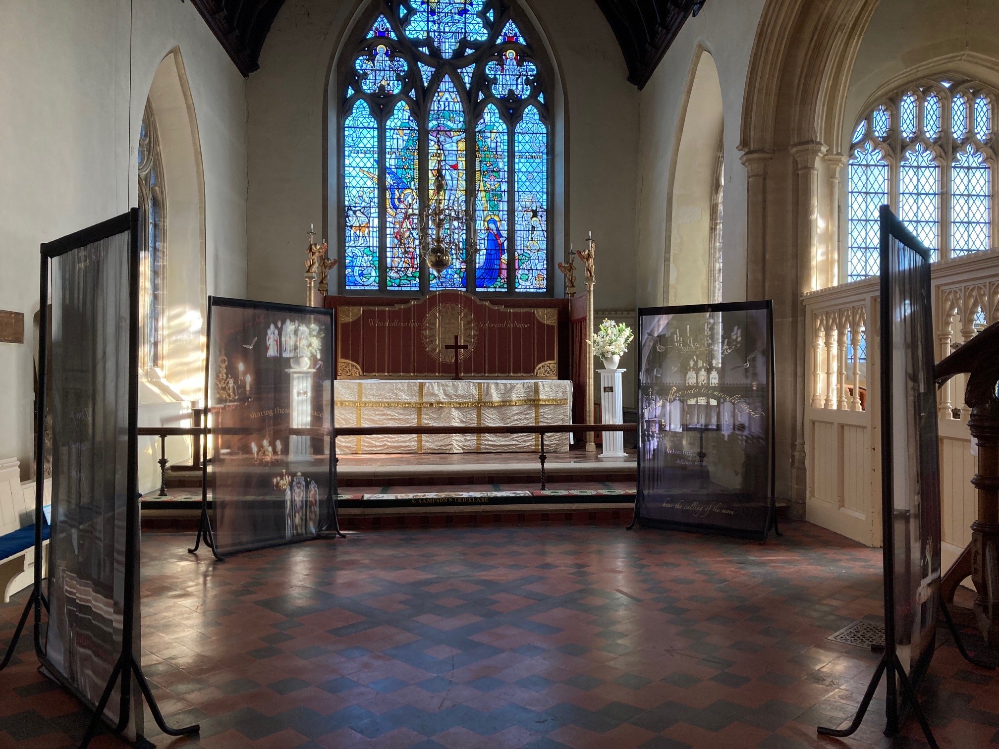 Panels from the On A Wing And A Prayer art installation on display inside St Sampson's Church
