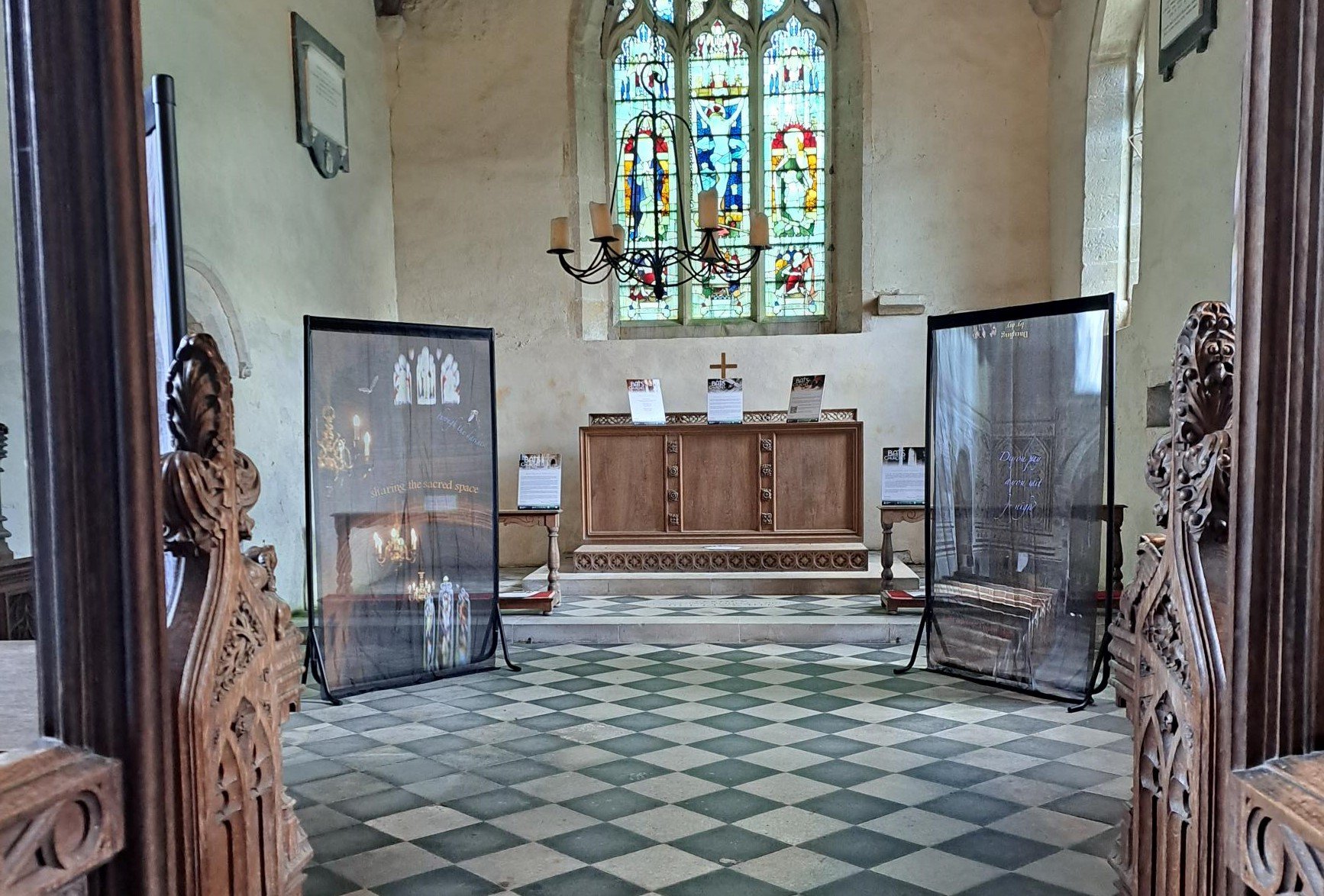 Two panels from the On A Wing And A Prayer art installation on display inside the chancel of Wintringham church