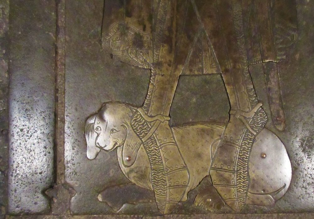 Detail of a brass dog from a funerary monument