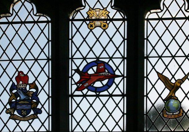 Church stained glass window with Red Arrow plane and regimental arms