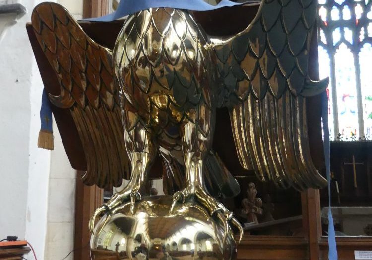 A brass lectern showing an eagle with two heads standing on a globe