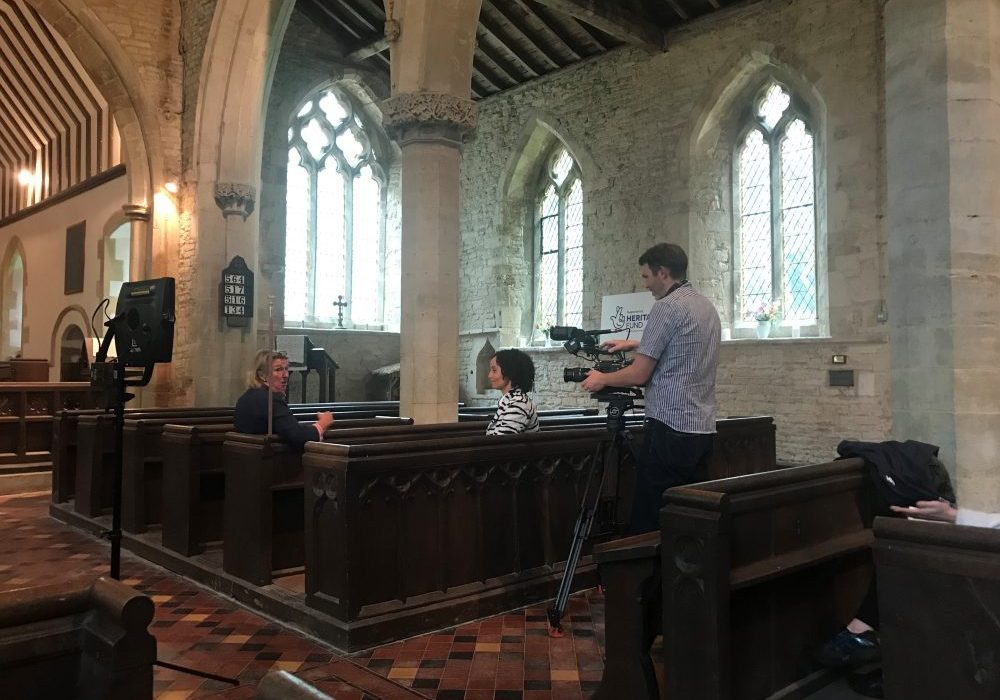 BBC Songs of Praise presenter Gemma Hunt interviewing churchwarden Penny Bonner inside St Lawrence church